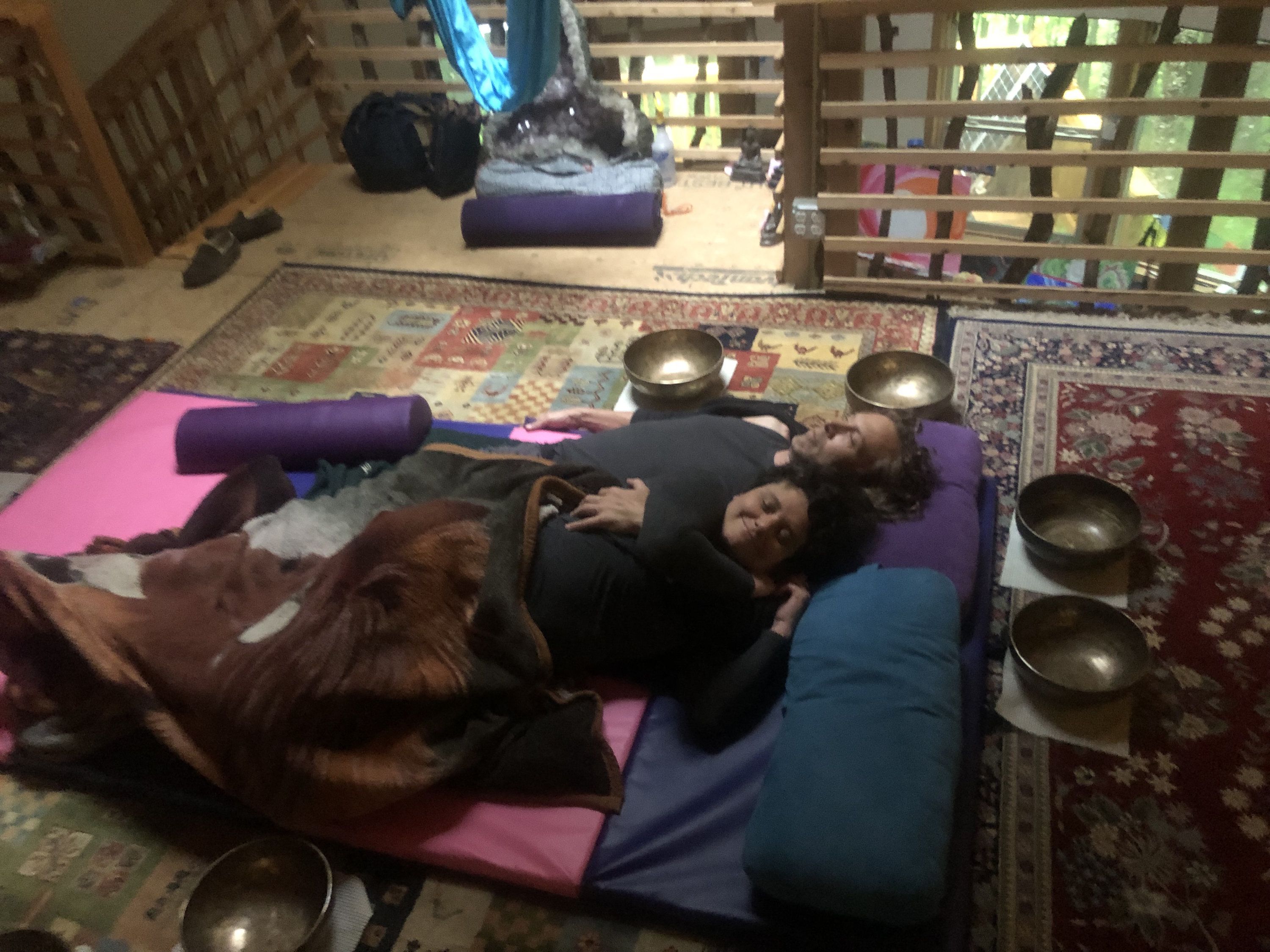 21 couple embracing, surrounded by singing bowls